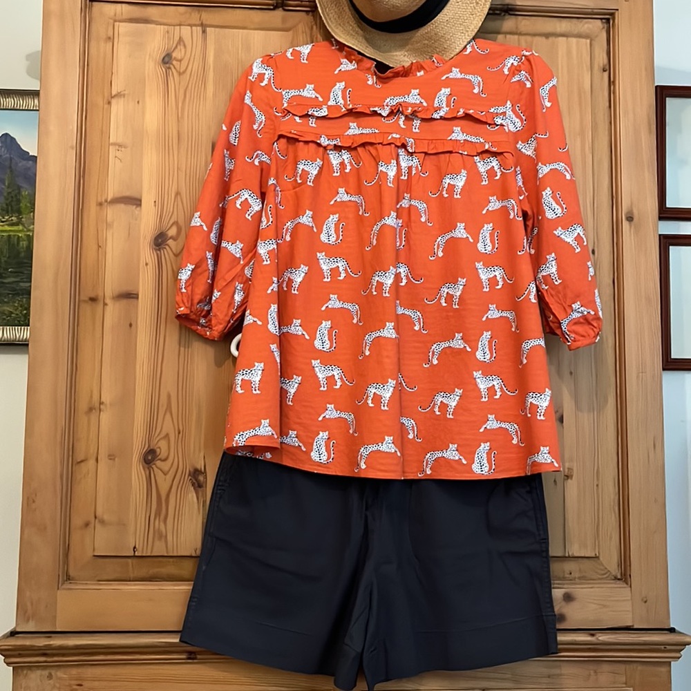 Michelle McDowell light cotton leopard print blouse. Citrusy orange w blue/white